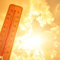 Thermometerwithorangeskyinbackgroundwithclouds