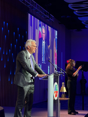 Man standing at a podium giving a speak.