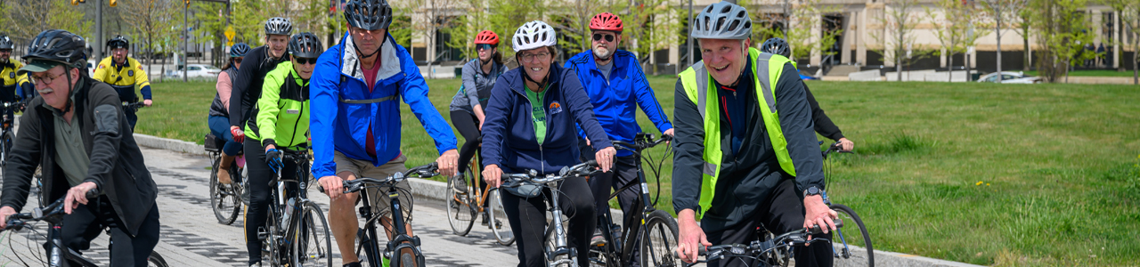 Chris Ronayne riding bike with Cuyahoga County citizens