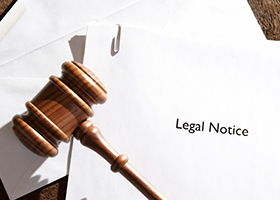 gavel on top of a legal notice