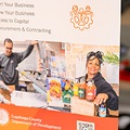 AstandingbanneraboutSmallBusinessissittingonatableinaworkshop