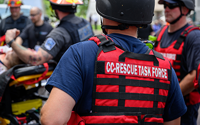 groupofRescueTaskForceworkershelpingapersononastretcher