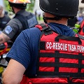 groupofRescueTaskForceworkershelpingapersononastretcher