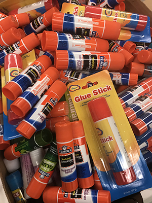 A pile of glue and glue sticks