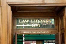 Law Library door wooden door with words Law Library on window
