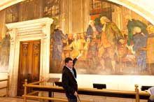 Mural on wall of County Courthouse man pointing to an old mural on the wall of the County Courthouse