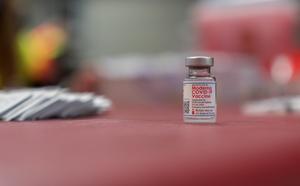 Vial of Moderna vaccine on a table