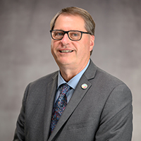 portrait of Paul Herdeg in a suit