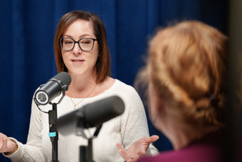 woman speaking into a microphone