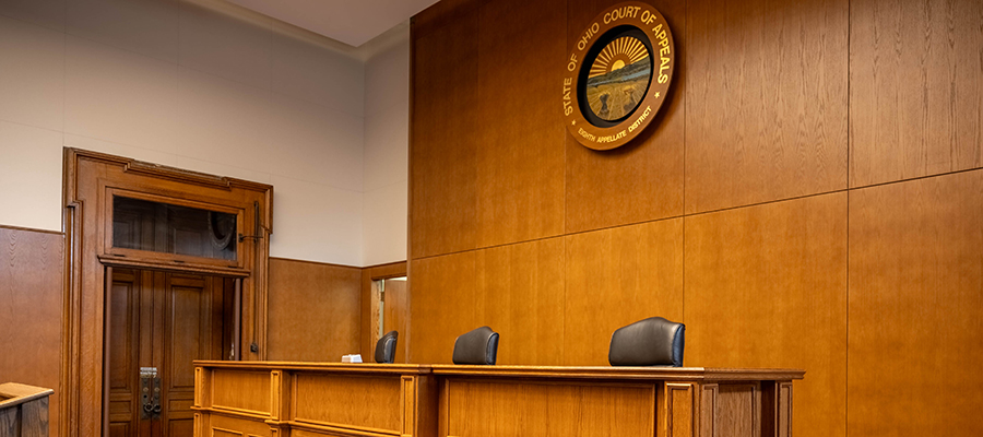 An empty courtroom showing where the judge would sit.