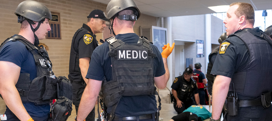 Some paramedics accessing an emergency situation.