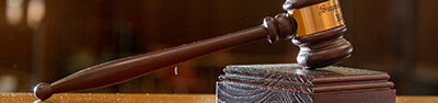 a wooden gavel on a table