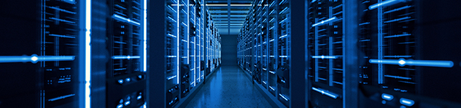 hallway of a data center with servers on both sides