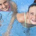 Fourchildrenswimminginapool