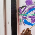 childwearingglassesandpainting