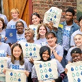 GroupofhighschoolstudentsstandingwithCuyahogaCountyExecutiveChrisRonayneandholdingFreshWatersigns