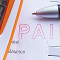 calculatorandpenontopofabillpayment