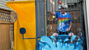 person sitting on a dunk tank